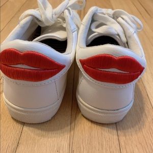 White tennis shoes sneakers with red lipstick